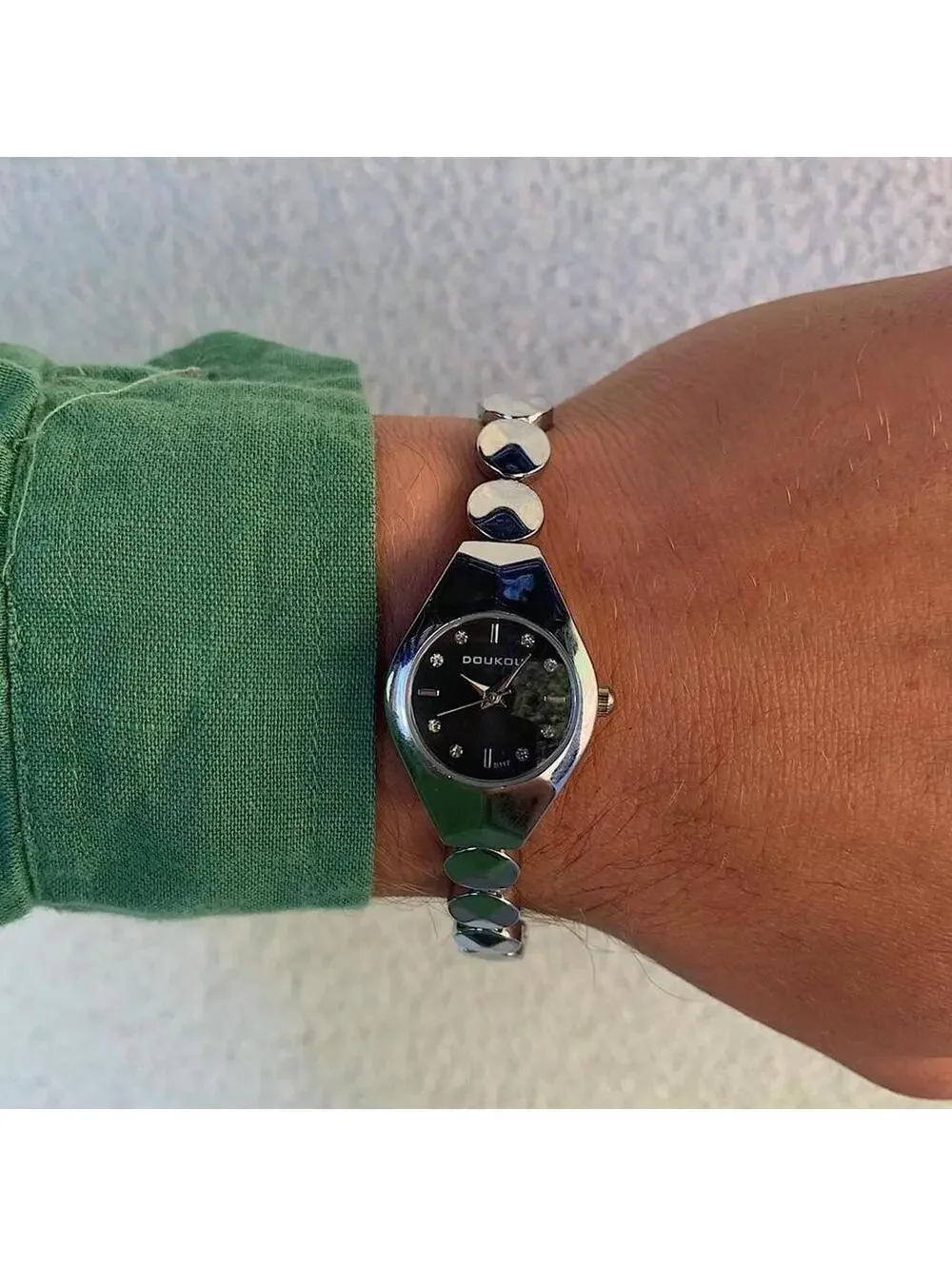 Black and silver watch with a unique design with rhinestones